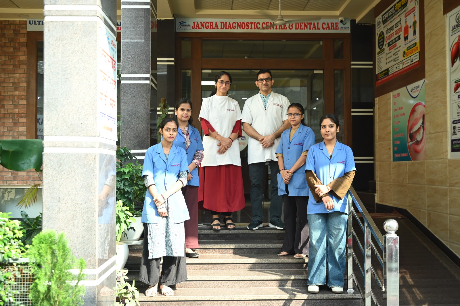 Medical team standing on the front steps of Jangra Diagnostic Centre
